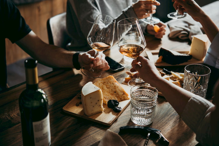 Clinking Glasses at a Wine Pairing