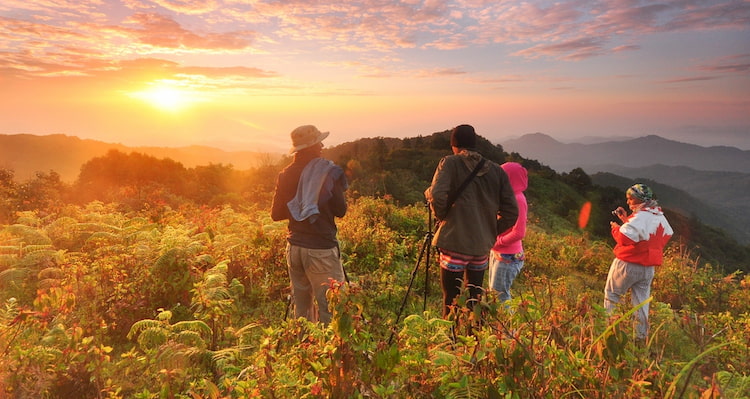 a group of hikers look out over Texas Hill Country