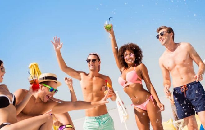 young people partying on a beach