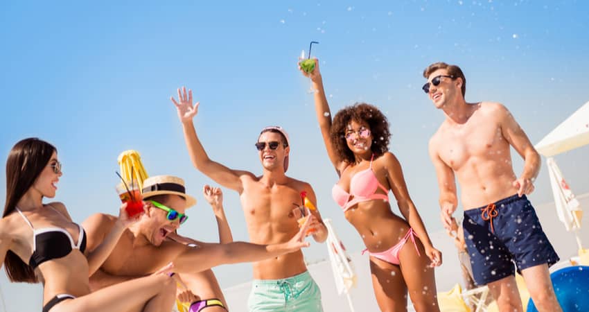 young people partying on a beach