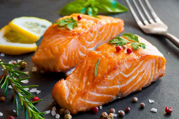 fresh grilled salmon with parsley garnish at woolworth in dallas