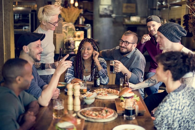 People sharing meal around table