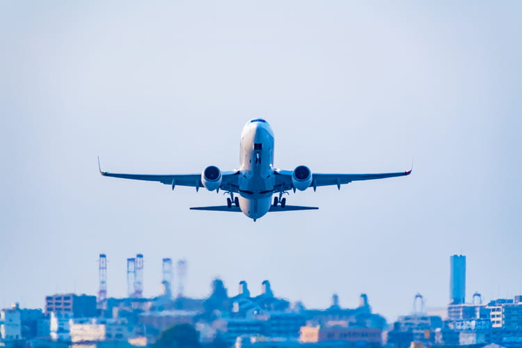 a plane takes off into the sky from an airport in houston