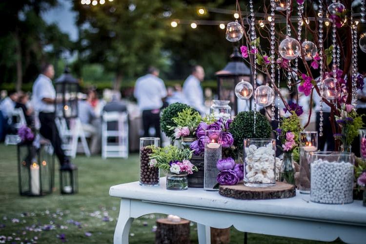 Wedding in a garden with purple and white color scheme