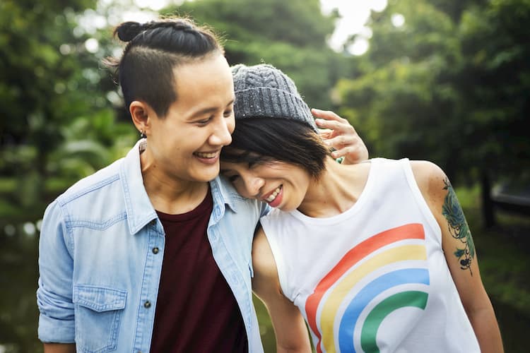 Lesbian couple walking outside