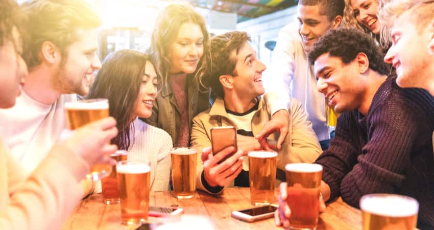 Friends smiling and having fun at a brewery 