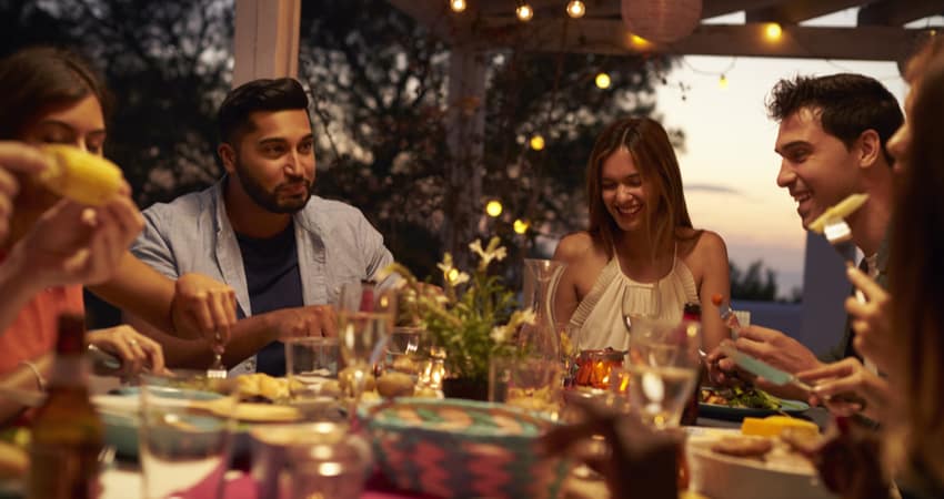 Friends dining outside on a patio