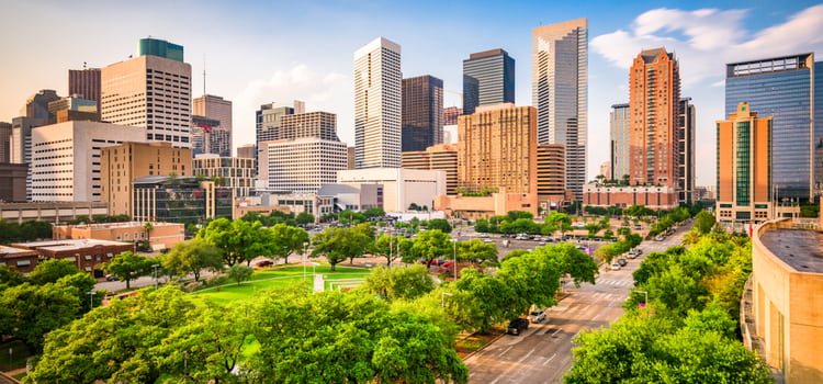 a view of the houston skyline on a sunny day