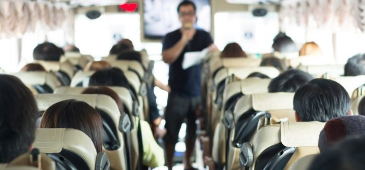 group on a bus with a bus tour guide