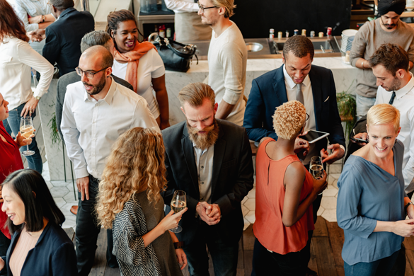 a group of corporate workers mingling