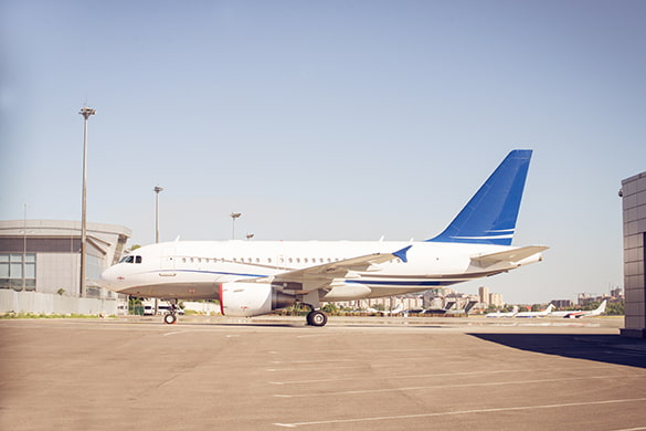 An airplane parks at a gate at Dallas Fort Worth International Airport