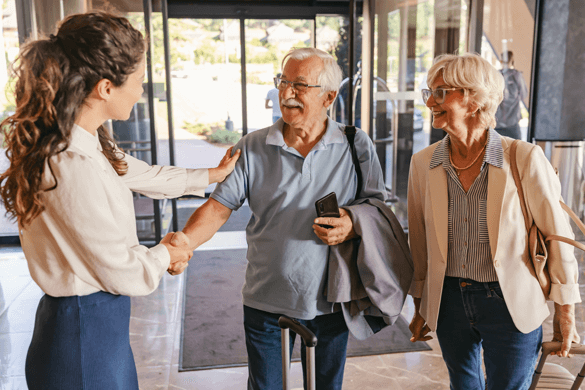 an older couple checks into a hotel