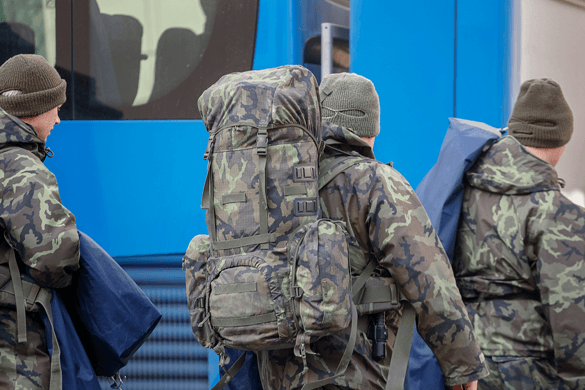 military members board a charter bus